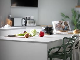 A kitchen with vegetables and kitchenware at Huxham View and Annex Stoke Canon