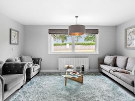 A living room with sofas and a coffee table at Huxham View and Annex Stoke Canon