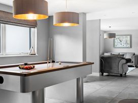 A game room with a pool table and a sofa at Huxham View and Annex Stoke Canon