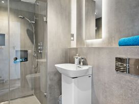 A bathroom with a shower and sink at Huxham View and Annex Stoke Canon