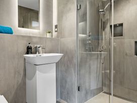 A bathroom with a sink and shower at Huxham View and Annex Stoke Canon