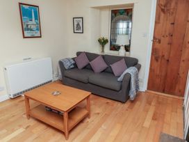 A living room with a sofa and coffee table at Sunny Brae in Alnwick