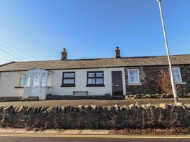 A house with multiple windows and a door at 2 Sunny Brae Embleton