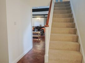 A staircase leading to an upper floor at Manor Cottage in Kingstone near Ilminster