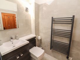 A bathroom with a sink and toilet at Tullythwaite Barn in Kendal