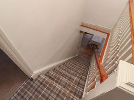 A staircase with patterned carpet at Tullythwaite Barn in Kendal