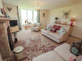 A living room with a sofa and television at Thimble Hill near Armathwaite