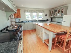 A kitchen with an island and appliances at Thimble Hill Near Armathwaite