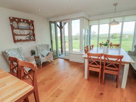 A dining room with a table and chairs at Thimble Hill near Armathwaite