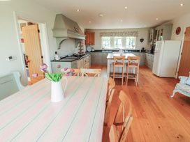 A kitchen with a table and chairs at Thimble Hill Near Armathwaite