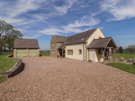 A house with a garage and driveway at Thimble Hill Near Armathwaite