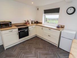 A kitchen with countertop appliances and storage at 1 Sunnybrae in Alnwick