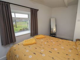 A bedroom with a bed and a window at 1 Sunnybrae, Alnwick