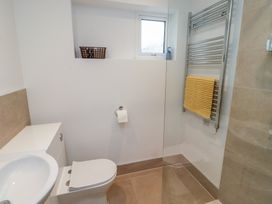A bathroom with a toilet, sink, and towel rail at 1 Sunnybrae in Alnwick