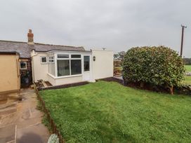A garden with a conservatory at 1 Sunnybrae Alnwick