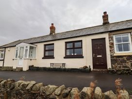 A cottage exterior with a front door and windows at 1 Sunnybrae Alnwick