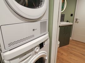A laundry room with washer and dryer at Unit 1 Ipswich