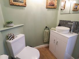 A bathroom featuring a toilet and a wash basin at Unit 1 in Ipswich
