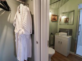 A bathroom with a sink and shower at Unit 1 in Ipswich
