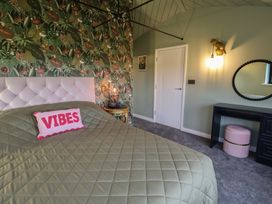 A bedroom with a bed and decorative items at Unit 1 in Ipswich