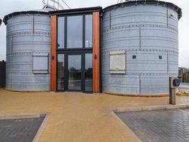 A building with silos and entrance door at Unit 1 in Ipswich