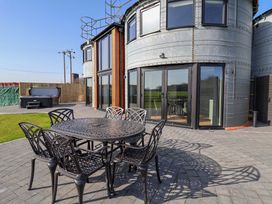 An outdoor area with a table and chairs at The Corn Silo in Ipswich