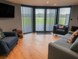 A living room with sofas and a television at Unit 2 in Ipswich