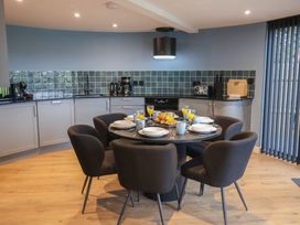 A kitchen with a dining table and chairs at Unit 2 in Ipswich