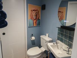 A bathroom with a toilet and sink at Unit 2 in Ipswich