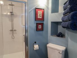 A bathroom featuring a shower, toilet, and towels at Unit 2 Ipswich
