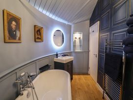 A bathroom with a bathtub and sink at Unit 2 in Ipswich
