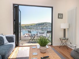 A living room with a view of the harbor at Ty'r Ddraig in Dartmouth