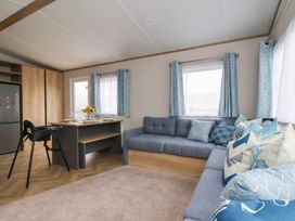 A living room with a sofa and table at No. 7 Ivy in Scarborough