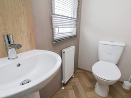 A bathroom with a sink and a toilet at No. 7 Ivy in Scarborough