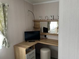 An office with a desk and television at TW89 in Exmouth