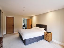 A bedroom featuring a bed and a nightstand at Cefn Coed in Presteigne