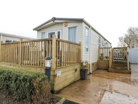 A mobile home with decking and steps at Plot 42 in Carlisle