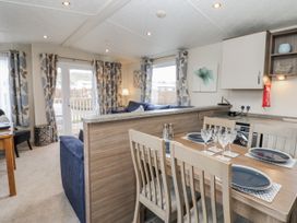 A dining area with a table and chairs at Plot 42 in Carlisle