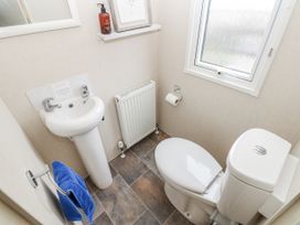 A bathroom with a sink and toilet at Plot 42 in Carlisle