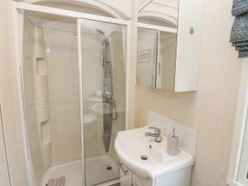 A bathroom with shower and sink at Plot 42 in Carlisle