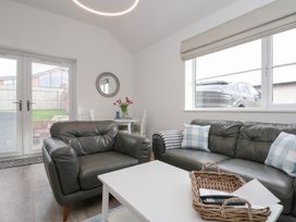 A living room with a sofa and coffee table at The Nest in 