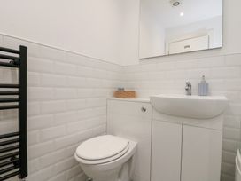 A bathroom with a sink and toilet at The Nest