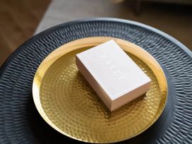 A box on a gold plate at Wren Cottage in Llangaffo