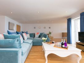 A living room with a sofa and coffee table at Mid Air in St. Ives