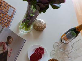 A indoor setting with flowers, snacks and champagne at Mid Air in St. Ives