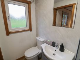 A bathroom with a sink and toilet at Oak Lodge Admaston near Abbots Bromley