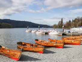 A view of rowboats and motorboats on a lake at Terabitha Lodge in Troutbeck