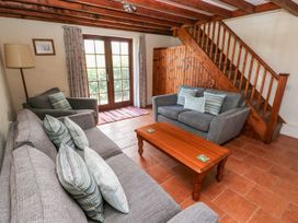 A living room with sofas and a coffee table at Ty Fferm in Newport