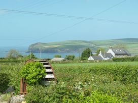 A coastal view with hills and houses at Ty Fferm in Newport