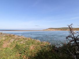 A view of water and hills at Ty Fferm in Newport